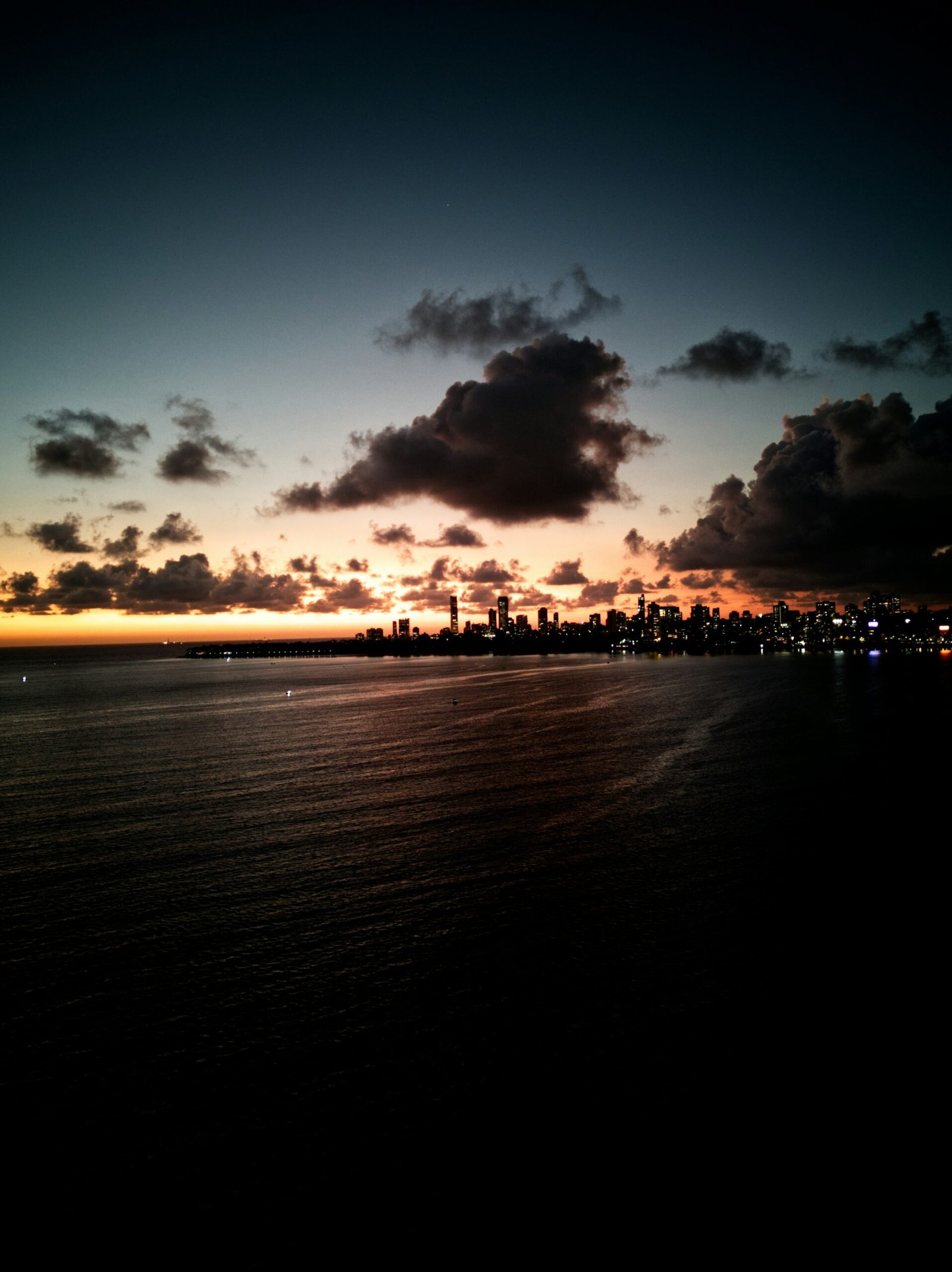 Marine Drive and the Mumbai skyline at dusk. City lifestyle photograph, not an advertised property.